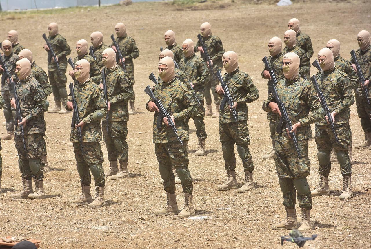 Los combatientes libaneses de Hezbolá participan en incursiones transfronterizas, parte de un ejercicio militar a gran escala, en Aaramta, en la frontera con Israel, el 21 de mayo de 2023