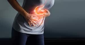 Woman touching stomach painful suffering from stomachache causes of menstruation period, gastric ulcer, appendicitis or gastrointestinal system disease. Healthcare and health insurance concept.