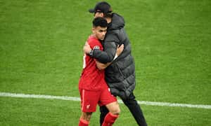 PARIS, FRANCE - MAY 28: Luis Diaz embraces Juergen Klopp, Manager of Liverpool after they are substituted during the UEFA Champions League final match between Liverpool FC and Real Madrid at Stade de France on May 28, 2022 in Paris, France. (Photo by Matthias Hangst/Getty Images)