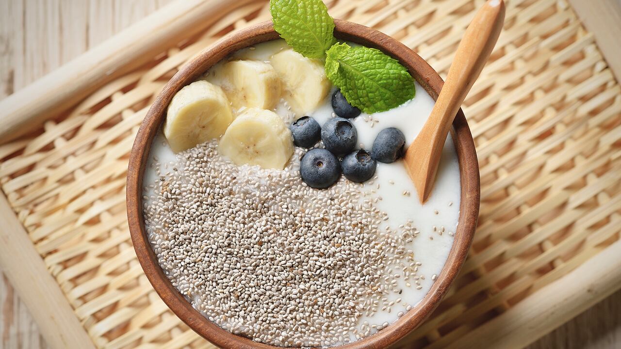 Raw chia seed, banana, blueberry and mint are topping to yogurt,Super food