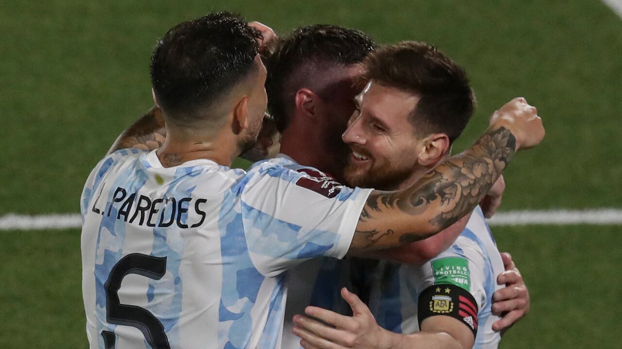 Argentina's Lionel Messi (R) celebrates with teammates after scoring against Uruguay during the South American qualification football match for the FIFA World Cup Qatar 2022 at the Monumental stadium in Buenos Aires, on October 10, 2021. (Photo by ALEJANDRO PAGNI / AFP)