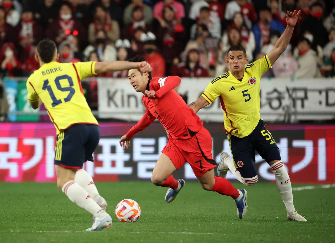 Soccer Football - International Friendly - South Korea v Colombia - Ulsan Munsu Football Stadium, Ulsan, South Korea - March 24, 2023 South Korea's Son Heung-min in action with Colombia's Kevin Duvan Castano Gil during the match REUTERS/Kim Hong-Ji