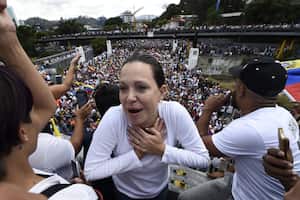 (FILES) Venezuela's radical opposition leader Maria Corina Machado gestures during a gathering with Venezuelan opposition leader Juan Guaido and thousands of supporters, in Caracas on February 2, 2019. The pre-candidate for the presidential elections scheduled for 2024 in Venezuela, Maria Corina Machado, of the most radical wing of the opposition, was disqualified from holding public office for 15 years, according to a document from the pro-government Comptroller General's Office released on June 30, 2023. (Photo by Federico PARRA / AFP)