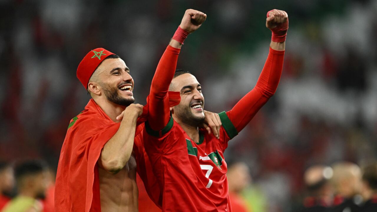 Soccer Football - FIFA World Cup Qatar 2022 - Round of 16 - Morocco v Spain - Education City Stadium, Al Rayyan, Qatar - December 6, 2022 Morocco's Hakim Ziyech celebrates with Romain Saiss after the penalty shootout as Morocco progress to the quarter finals REUTERS/Dylan Martinez