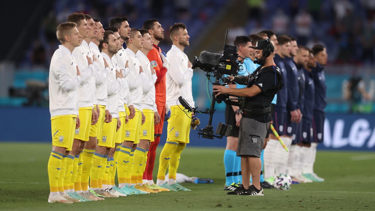 ROME, ITALY - JULY 03: Players of Ukraine stand for the national anthem prior to the UEFA Euro 2020 Championship Quarter-final match between Ukraine and England at Olimpico Stadium on July 03, 2021 in Rome, Italy. (Photo by Lars Baron/Getty Images)