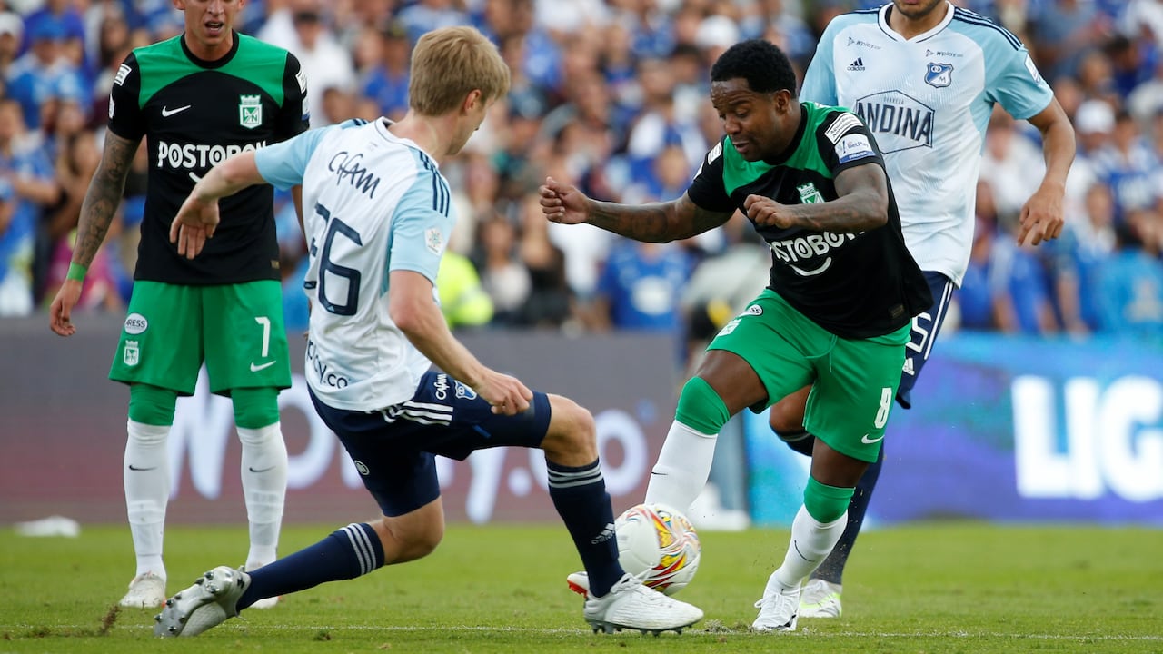 BOGOTA, COLOMBIA - AUGUST 27: Andres Llinas (L) of Millonarios fights for the ball against Dorlan Pabon of Nacional during a liga BetPlay match between Millonarios and Nacional at El Campin stadium on August 27, 2023 in Bogota, Colombia. (Photo by John Vizcaino/VIEWpress)