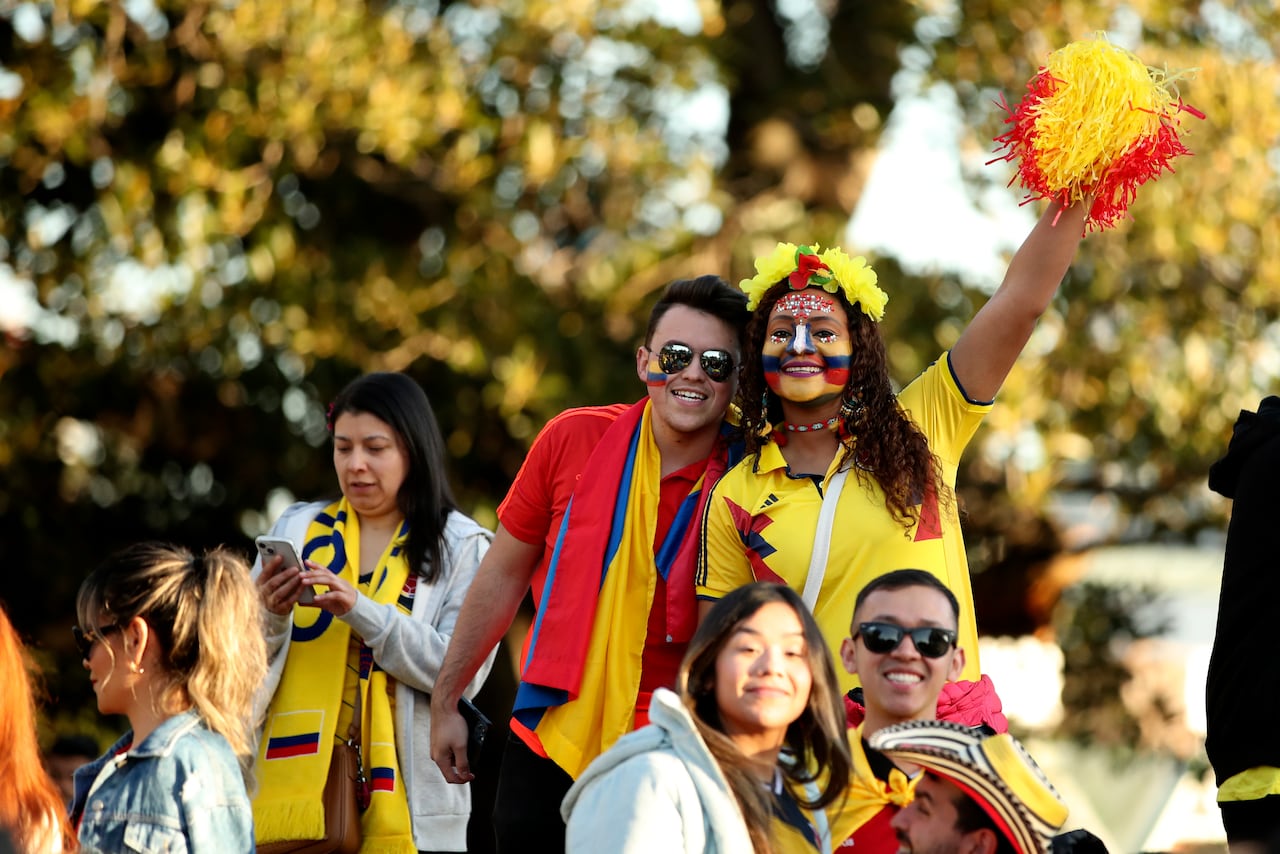 Fans smile and cheer prior the Women's World Cup Group H soccer match between Morocco and Colombia in Perth, Australia, Thursday, Aug. 3, 2023. (AP Photo/Gary Day)