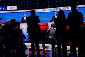 Photographers take photos of President Joe Biden, right, and Republican presidential candidate former President Donald Trump, left, during a break in a presidential debate hosted by CNN, Thursday, June 27, 2024, in Atlanta. (AP Photo/Gerald Herbert)