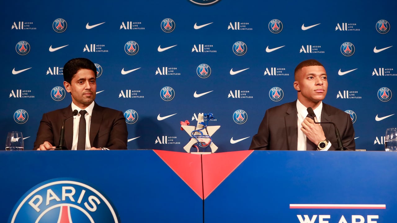PARIS, FRANCE - MAY 23: President of Paris Saint-Germain, Nasser Al-Khelaifi and Kilian Mbappe speak to the media after Mbappe signs a new contract with PSG at Parc des Princes on May 23, 2022 in Paris, France. (Photo by Julien Hekimian - PSG/PSG via Getty Images)