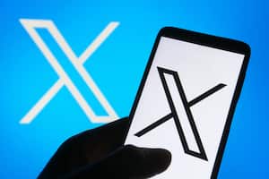 UKRAINE - 2023/07/25: In this photo illustration, the new Twitter logo rebranded as X (X Corp.) is seen on a smartphone and on a pc screen. (Photo Illustration by Pavlo Gonchar/SOPA Images/LightRocket via Getty Images)