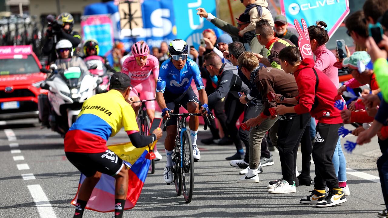 LIVIGNO - MOTTOLINO, ITALY - MAY 19: (L-R) Tadej Pogacar of Slovenia and UAE Team Emirates - Pink Leader Jersey and Nairo Quintana of Colombia and Movistar Team compete in the breakaway climbing the Mottolino (2387m) while fans cheer during the 107th Giro d'Italia 2024, Stage 15 a 222km stage from Manerba del Garda to Livigno - Mottolino 2387m / #UCIWT / on May 19, 2024 in Livigno - Mottolino, Italy. (Photo by Luca Bettini - Pool/Getty Images)