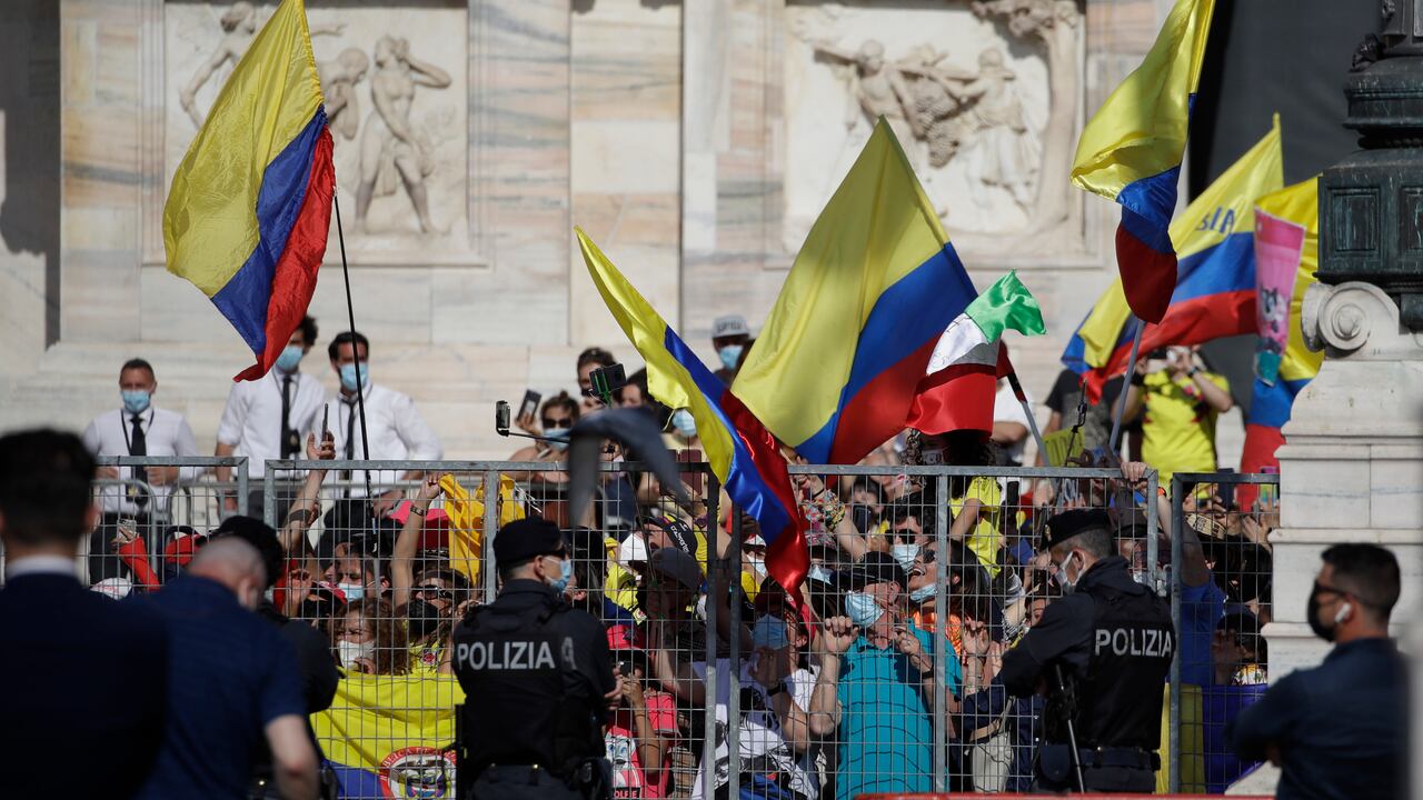 Colombian fans celebrate as Egan Bernal completes the final stage to win the Giro d'Italia cycling race, a 30.3 kilometers individual time trial from Senago to Milan, Italy, Sunday, May 30, 2021. (AP Photo/Luca Bruno)