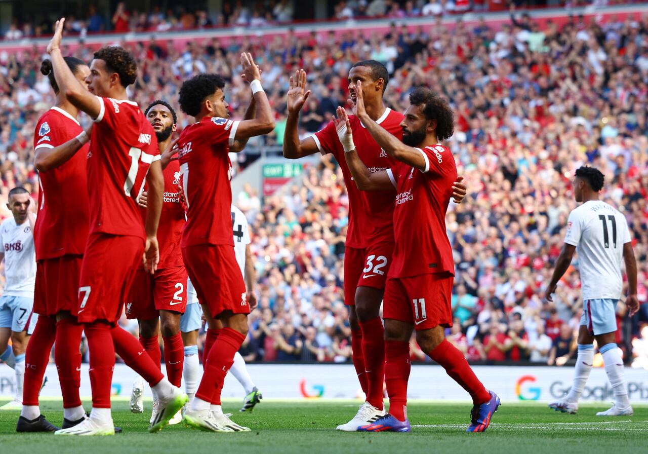 Soccer Football - England - Premier League - Liverpool v Aston Villa - Anfield, Liverpool, Britain - September 3, 2023 Liverpool's Mohamed Salah celebrates scoring their third goal with Joel Matip and Luis Diaz REUTERS/Molly Darlington EDITORIAL USE ONLY. No use with unauthorized audio, video, data, fixture lists, club/league logos or 'live' services. Online in-match use limited to 75 images, no video emulation. No use in betting, games or single club /league/player publications.  Please contact your account representative for further details.