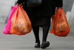 LONDON - FEBRUARY 29:  Shoppers leave a Sainsbury's store with their purchases in plastic bags on February 29, 2008 in London, England. The Prime Minister Gordon Brown has stated that he will force retailers to help reduce the use of plastic bags if they do not do so voluntarily.  (Photo by Cate Gillon/Getty Images)