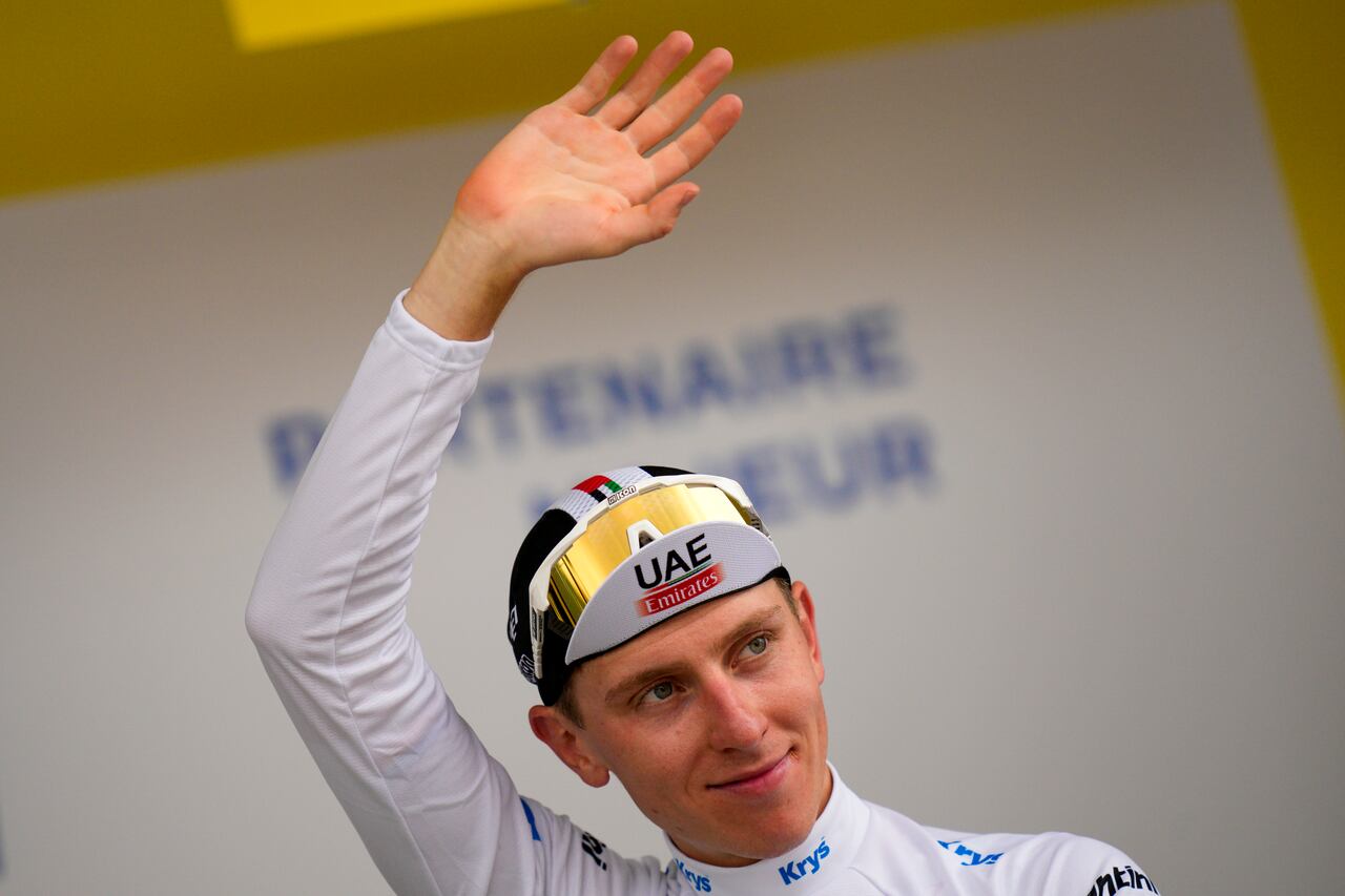 Slovenia's Tadej Pogacar, wearing the best young rider's white jersey, reacts on the podium after the sixteenth stage of the Tour de France cycling race, an individual time trial over 22.5 kilometers (14 miles) with start in Passy and finish in Combloux, France, Tuesday, July 18, 2023. (AP Photo/Daniel Cole)