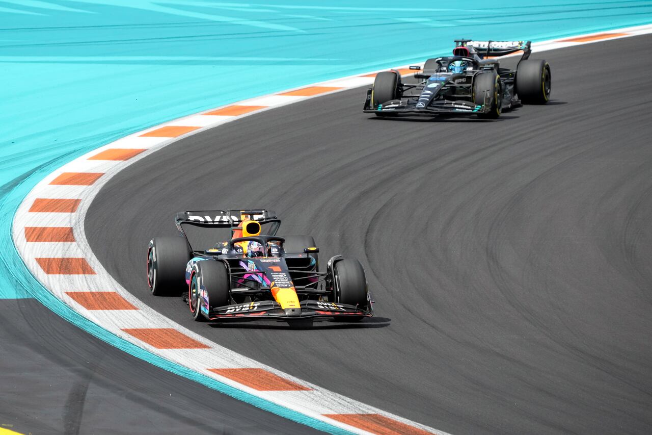 Max Verstappen (1) leads George Russell (63) through a turn during the Formula One Miami Grand Prix auto race at the Miami International Autodrome, Sunday, May 7, 2023, in Miami Gardens, Fla. (AP Photo/Wilfredo Lee)