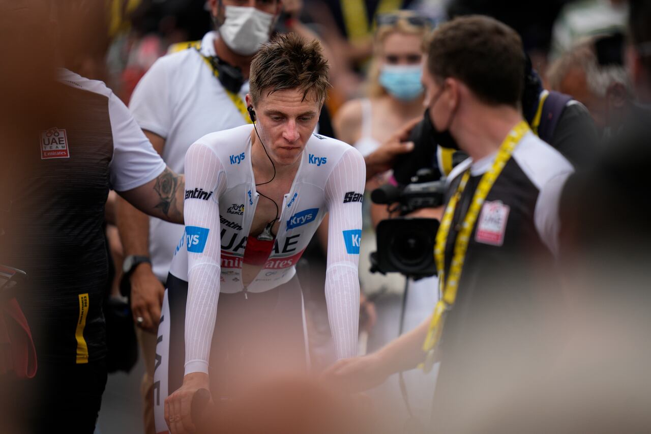 Slovenia's Tadej Pogacar, wearing the best young rider's white jersey, reacts after losing time on his main rival Denmark's Jonas Vingegaard in the sixteenth stage of the Tour de France cycling race, an individual time trial over 22.5 kilometers (14 miles) with start in Passy and finish in Combloux, France, Tuesday, July 18, 2023. (AP Photo/Daniel Cole)