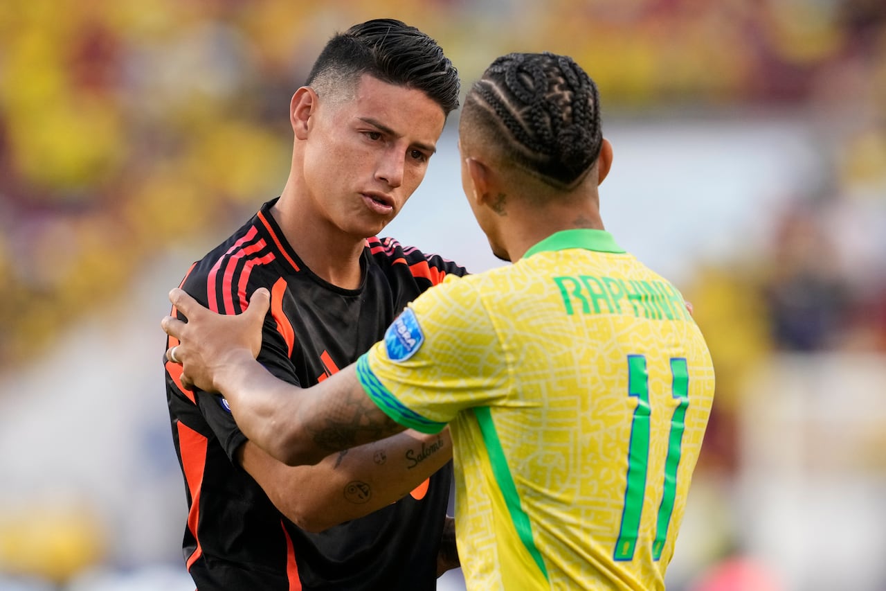 Colombia's James Rodriguez, left, greets Brazil's Raphinha after Colombia tied Brazil 1-1 in a Copa America Group D soccer match Tuesday, July 2, 2024, in Santa Clara, Calif. (AP Photo/Godofredo A. Vásquez)