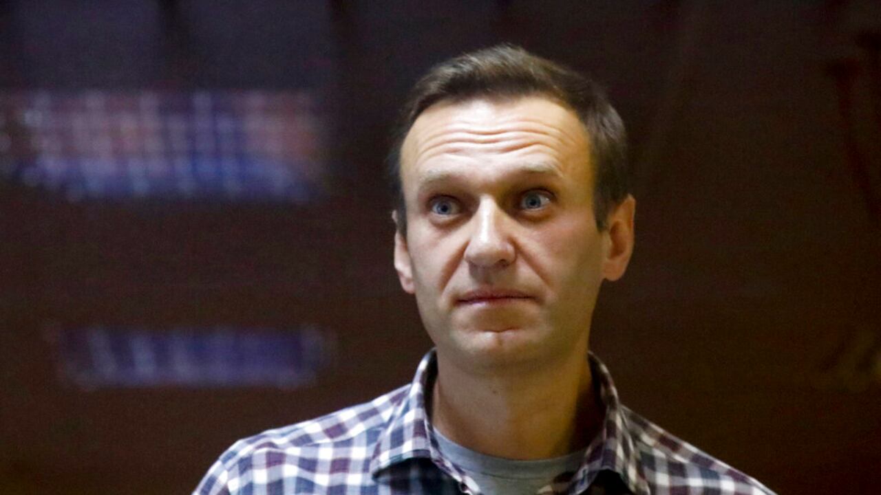 FILE - In this Saturday, Feb. 20, 2021 file photo, Russian opposition leader Alexei Navalny stands in a cage in the Babuskinsky District Court in Moscow, Russia. A doctor for imprisoned Russian opposition leader Alexei Navalny, who is in the third week of a hunger strike, said on Saturday April 17, 2021, his health is deteriorating rapidly and the 44-year-old Kremlin critic could be on the verge of death. (AP Photo/Alexander Zemlianichenko, File)