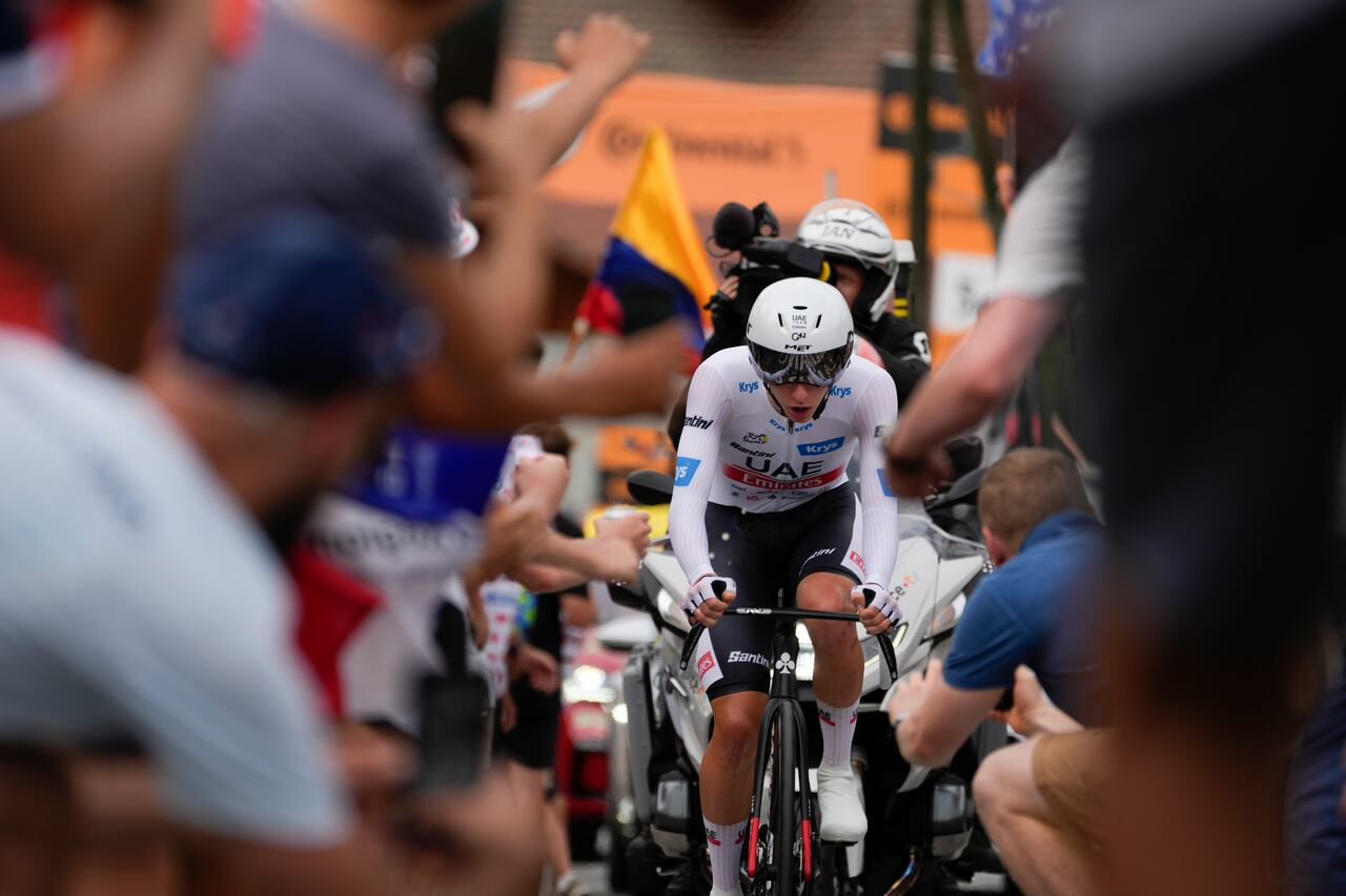 Slovenia's Tadej Pogacar, wearing the best young rider's white jersey, climbs during the sixteenth stage of the Tour de France cycling race, an individual time trial over 22.5 kilometers (14 miles) with start in Passy and finish in Combloux, France, Tuesday, July 18, 2023. (AP Photo/Thibault Camus)