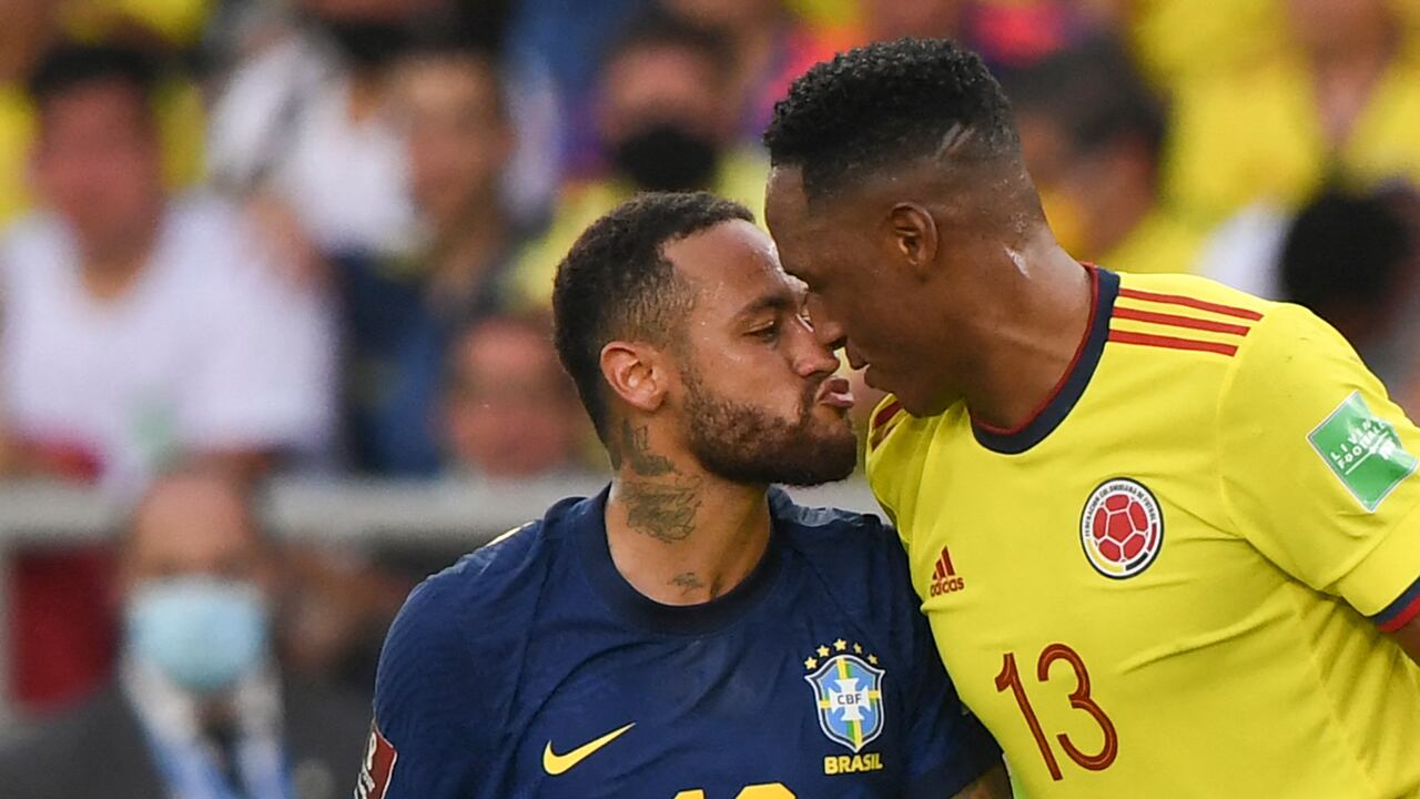 Brazil's Neymar (L) and Colombia's Yerry Mina (R) are seen during their South American qualification football match for the FIFA World Cup Qatar 2022 at the Metropolitano stadium in Barranquilla, Colombia, on October 10, 2021.
JUAN BARRETO / AFP