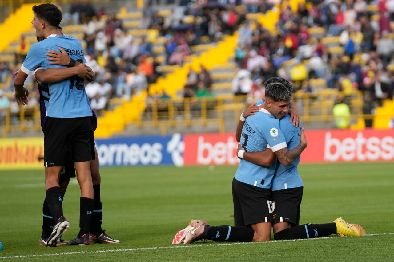 Uruguay players celebrate at the end of a South America U-20 soccer match against Ecuado,r in Bogota, Colombia, Friday, Feb. 3, 2023. Uruguay won 2-1. (AP Photo/Fernando Vergara)