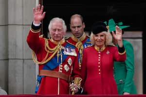 King Charles III and Camilla, the Queen Consort, greet the crowd from the balcony of Buckingham Palace after the Trooping The Colour parade, in London, Saturday, June 17, 2023. Trooping the Colour is the King's Birthday Parade and one of the nation's most impressive and iconic annual events attended by almost every member of the Royal Family.(AP Photo/Alastair Grant)